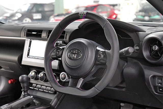 HKS Direct Fit Steering Wheel Black Smooth Leather w/ Perforated Grip, Oil Slick Stitching, and Embroidered HKS Logo 2017-2025 BRZ / 2022-2025 GR86 / 2017-2020 GT86