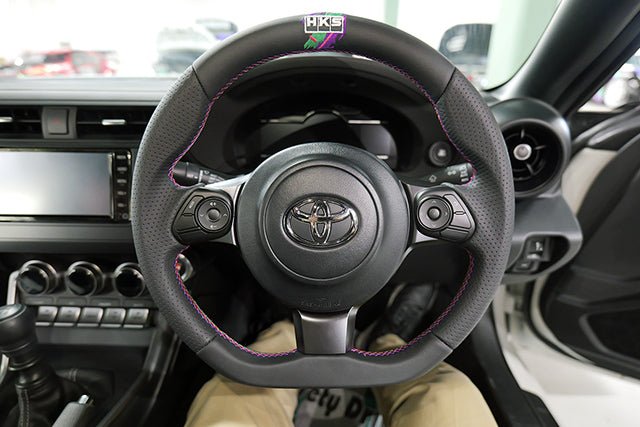 HKS Direct Fit Steering Wheel Black Smooth Leather w/ Perforated Grip, Oil Slick Stitching, and Embroidered HKS Logo 2017-2025 BRZ / 2022-2025 GR86 / 2017-2020 GT86