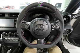 HKS Direct Fit Steering Wheel Black Smooth Leather w/ Perforated Grip, Oil Slick Stitching, and Embroidered HKS Logo 2017-2025 BRZ / 2022-2025 GR86 / 2017-2020 GT86